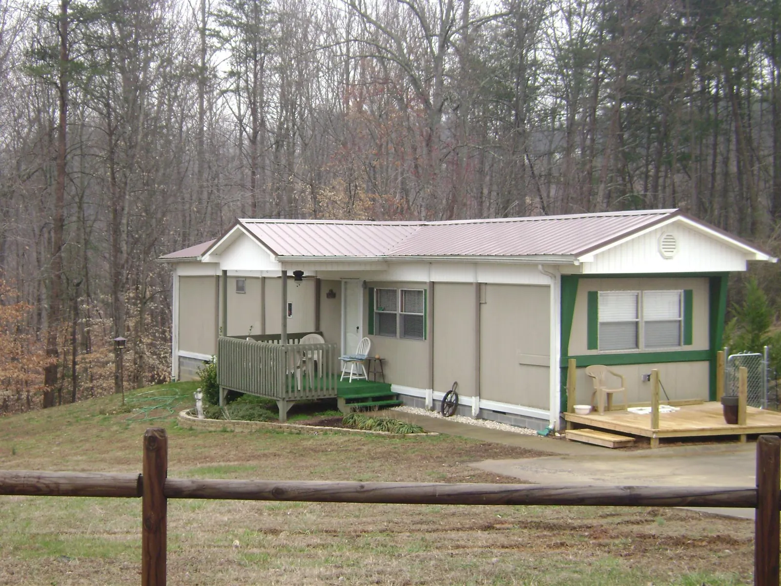Mauve metal roof on a manufactured home with a new front deck in Eaton